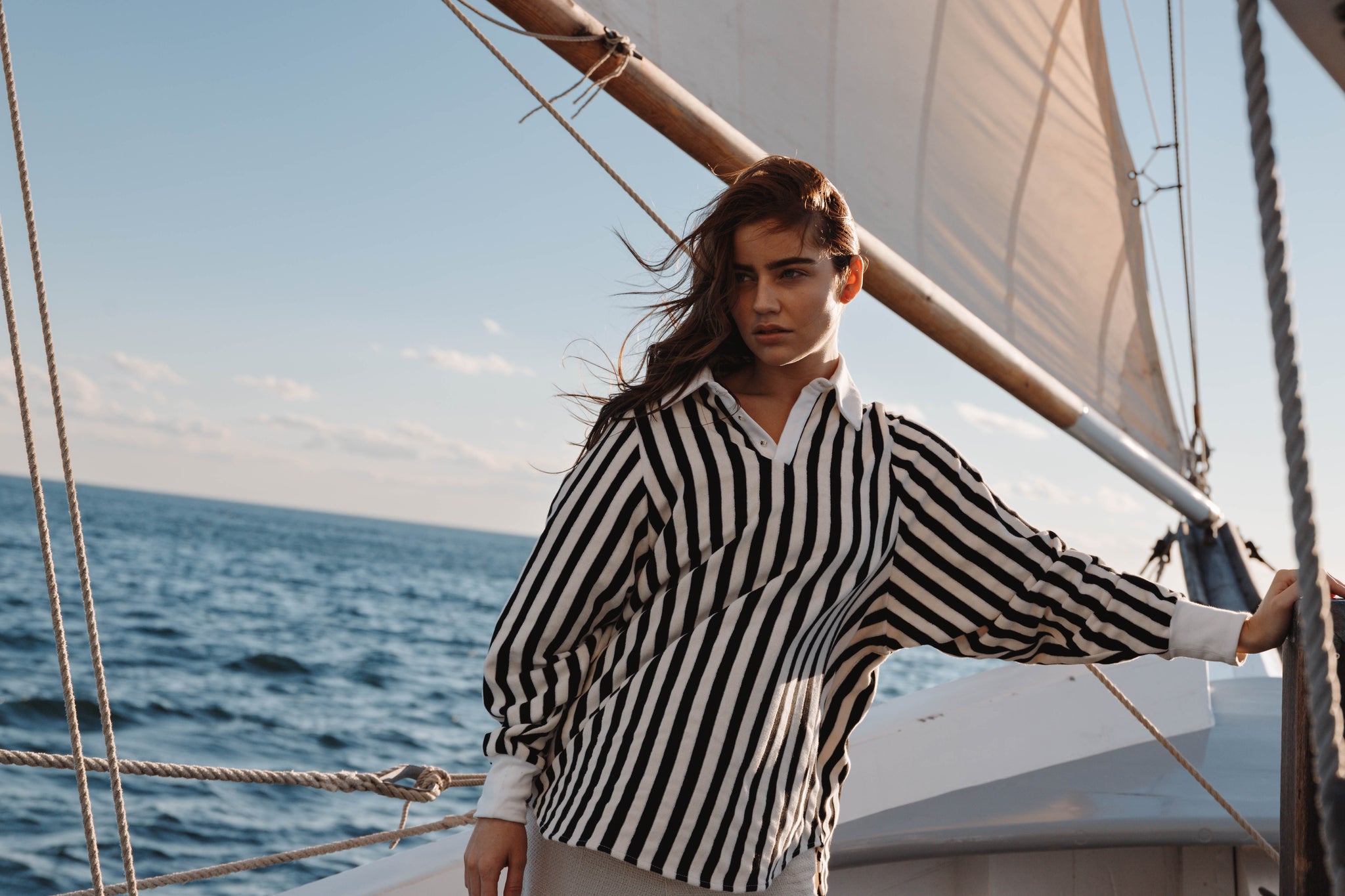 black and cream rugby Polo pullover with longsleeves on sailboat