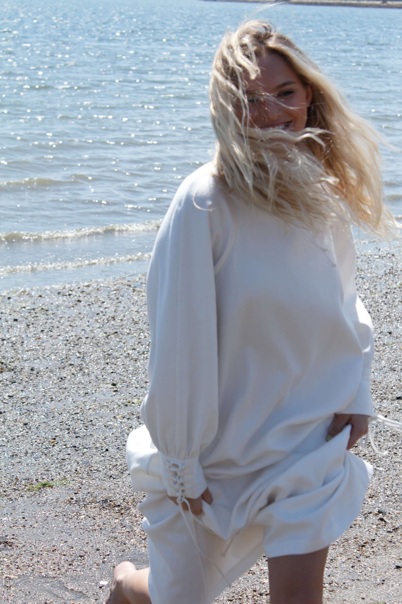 A white long sleeve maxi dress. Long sleeve maxi dress with high-neck made from soft hemp fabric.